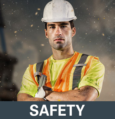 Construction worker in a white hard hat and safety vest representing HAIX safety boots category on a grey background